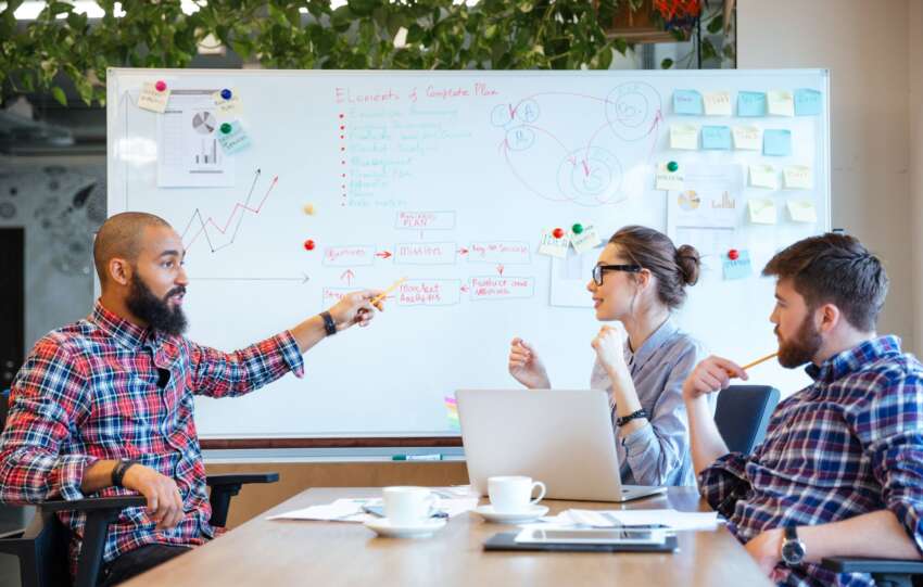 image of team working on a problem